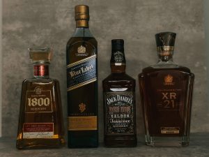 three bottles of liquor sitting next to each other